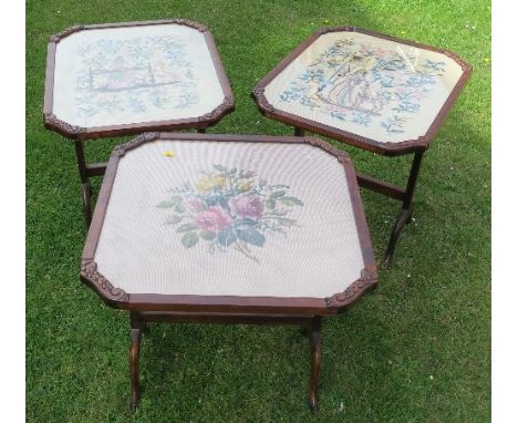 Three glass top tilting tables, the tops set with tapestry pictures, with oak frame and base