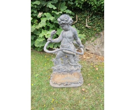 A 19th century cast iron stick stand, modelled with the young Hercules wrestling a serpent, height 33ins, width 20insConditio