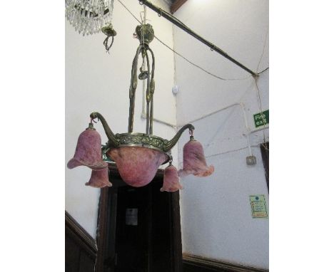 A light fitting, with pink shades