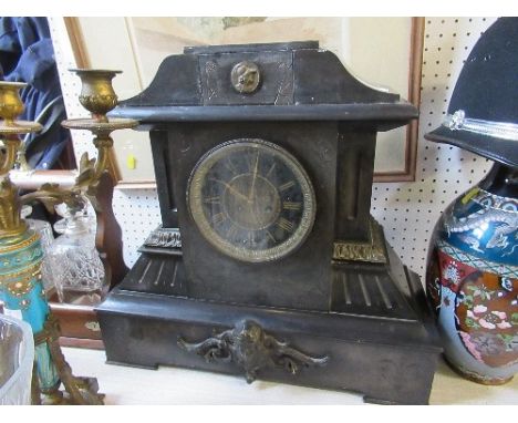 A black slate mantel clock