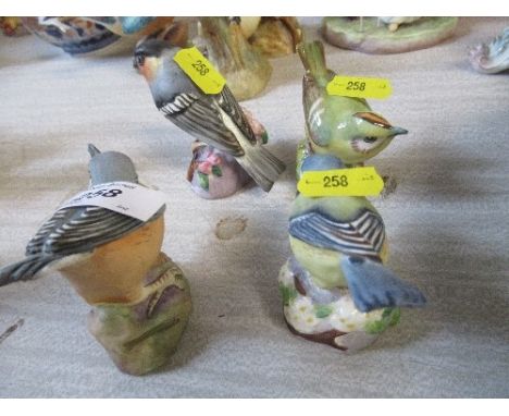 Four Royal Worcester birds
