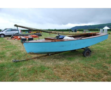 A Sailing Boat "Lady Jane" 4.3 m long, with the associated trailer, sail, mast, a rudder, a knife-board keel, a bilge bailer,