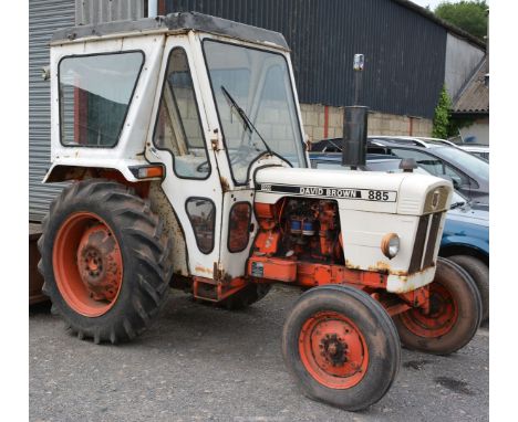 A David Brown/Case 885 3 cylinder diesel-engined, 12-speed farm tractor with safety cab and having the local registration No.
