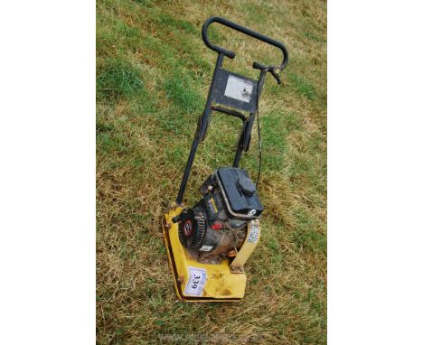 A 97cc 'Compactor' petrol whacker plate, (engine starts easily and runs o.k.).