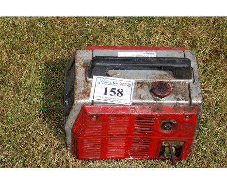 A petrol engined suitcase generator (engine turns).