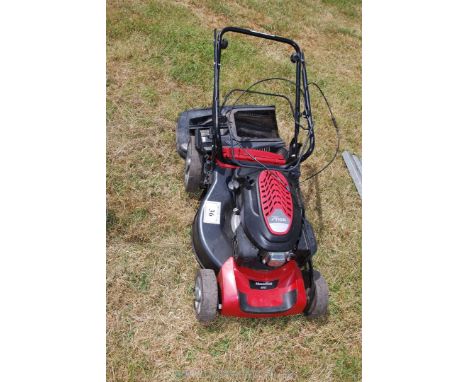 A Mountfield SP53 Stiga petrol lawn mower with grassw box (turns but engine stiff).