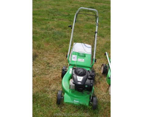 A Viking 2 MB248T lawn mower with Briggs &amp; Stratton petrol engine, good compression and grass collector present. 