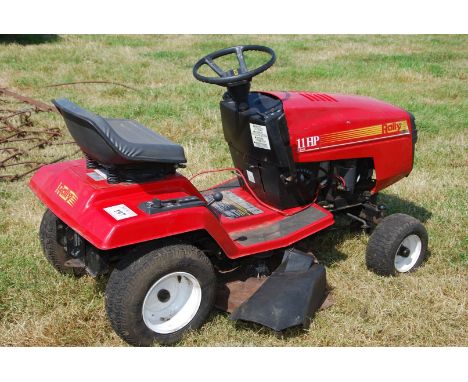 A Rally 11 h.p. four-speed ride-on mower with a Briggs &amp; Stratton 12 h.p. petrol engine. Needs some attention - engine do