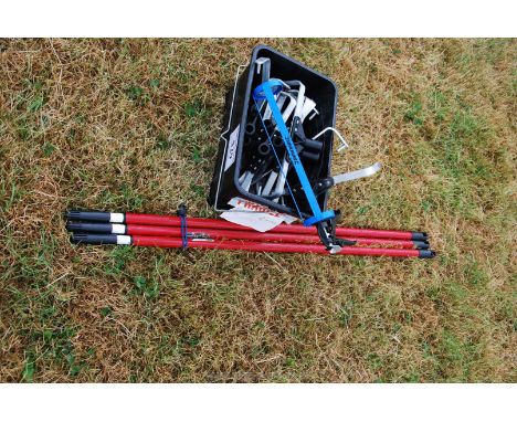 Three paint roller handles and attachments and a mastic gun.