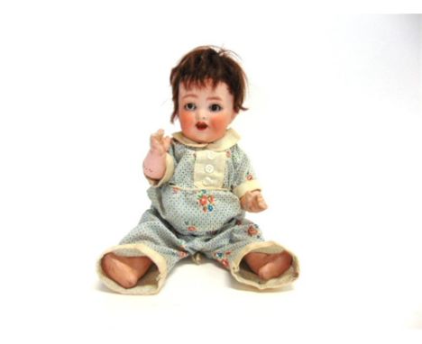 A HEUBACH OF KOPPELSDORF BISQUE SOCKET-HEAD DOLL with a cropped brown wig, sleeping brown glass eyes, and an open mouth with 