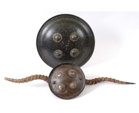 AN INDO-PERSIAN DHAL SHIELD 19th century, with foliate decoration, 37cm diameter; together with an Indian Maduvu parrying shi