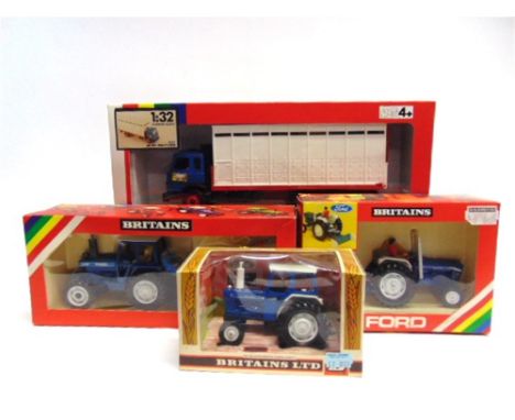 A BRITAINS FARM COLLECTION comprising No.9524, Ford 6600 Tractor; No.9598, Ford 7710 Tractor and Rear Digger; No.9516, Ford 6