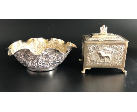 UNMARKED INDIAN SILVER BOWLthe frilly rimmed oval bowl profusely decorated with animal and jungle scene, with gilt interior, 