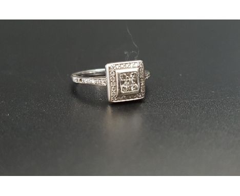 DIAMOND CLUSTER RINGin eighteen carat white gold with square setting, the diamonds totalling approximately 0.25cts, ring size