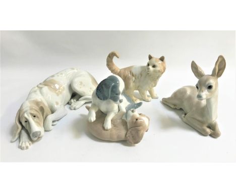 FOUR LLADRO AND NAO ANIMAL ORNAMENTScomprising a Lladro reclining dog, a Lladro fawn, a Nao cat and a Nao group of two puppie