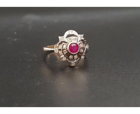 RUBY AND DIAMOND CLUSTER RINGthe central round cut ruby in pierced multi diamond set surround, on nine carat gold shank, ring