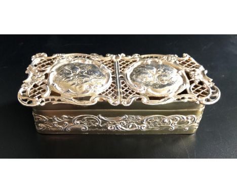 ART NOUVEAU SILVER GILT TRINKET BOXthe hinged cover with two circular panels decorated with cherubs in pierced scroll decorat