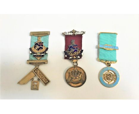 THREE MASONIC MEDALSrelating to Wharton Lodge No.2045, with two examples in silver gilt and enamel, one with pierced decorati