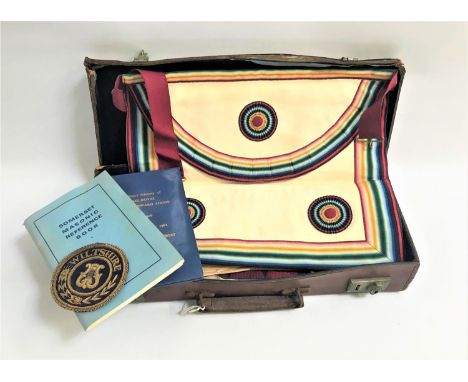 COLLECTION OF MASONIC REGALIAcontained in a tan leather case including a black watered silk shoulder sash, two aprons and a s