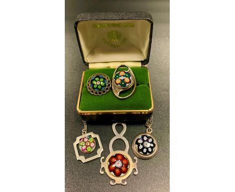 FOUR PIECES OF CAITHNESS SILVER JEWELLERYcomprising three pendants on chains and one ring, together with another similar ring