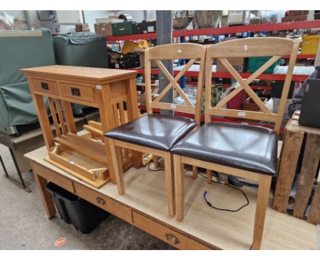 A modern light oak side table together with a kitchen dining and two chairs.