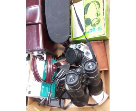 A box of cameras including Zenit, Olympia, binoculars, Acer tablet, headphones, Bolex cine camera