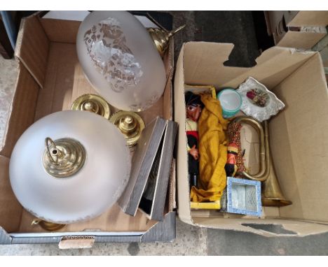 Two boxes of assorted items including glass and brass light fittings, a Pelham pirate puppet, ceramics, brass bugle, boxed cu