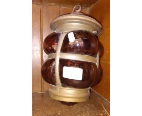A ship's or carriage lantern with coloured glass.  