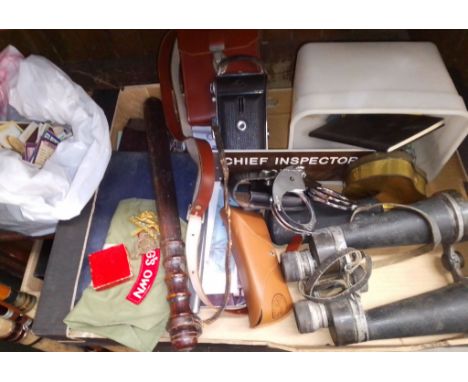 A box of collectables including binoculars, police truncheon, sun glasses, badges, police handcuffs, AA badge, police buttons