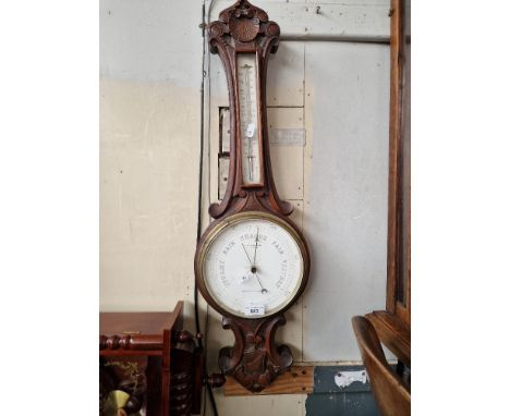 An early 20th century barometer/thermometer, the dial marked 'W Aronsberg Optician, Manchester &amp; Leeds'.  