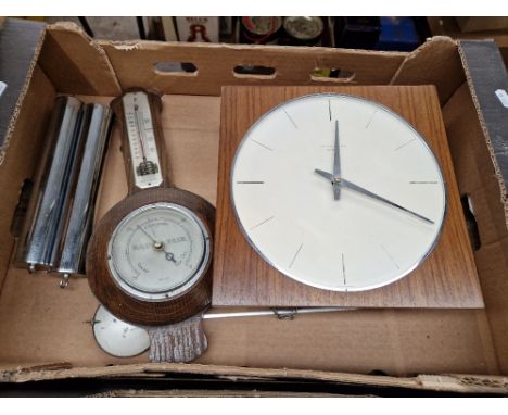 A Jungans Meister wall clock and a barometer.  