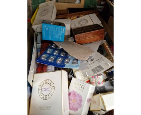 A box of assorted items including perfume bottles, pen accessories, a cribbage board etc. etc.