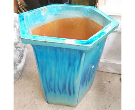 A hexagonal glazed planter  