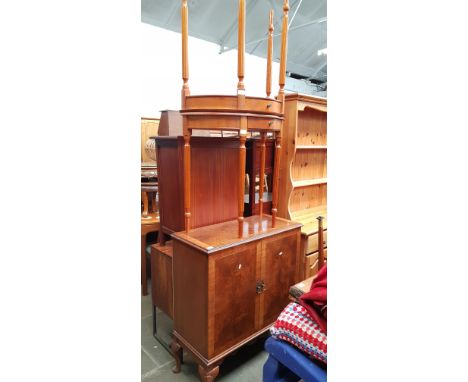 A walnut drinks cabinet together with a pair of demi-lune side tables.  