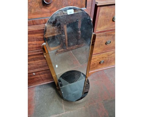 A 1930s Art Deco mirror with peach glass panels and shelf to base.  