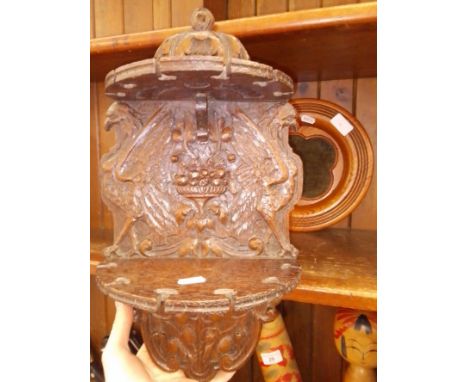 A carved two tier wall mounted pipe rack and a church collection tray.  