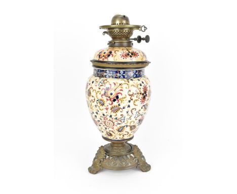 A Hungarian porcelain oil lamp by Ignác Fischer, late 19th/early 20th century, Budapest, with lobbed body painted with stylis