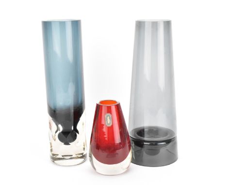 A Whitefriars glass candle holder, in indigo with hurricane shade, 24 cm high, together with a Whitefriars bud vase in ruby w