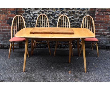 A mid 20th century beech and elm extending Grand Windsor dining table by Ercol, with rectangular top with rounded edges, with