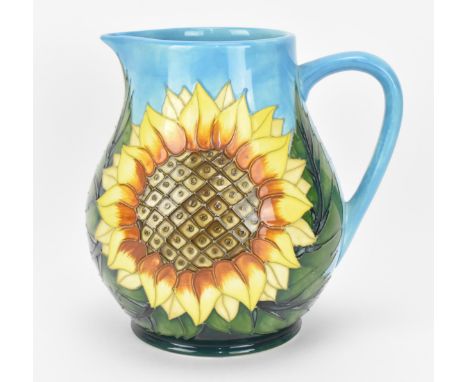 A Moorcroft 'Sunflower' pattern jug designed by Sally Tuffin, of baluster form with large tube-lined flowers against a light 