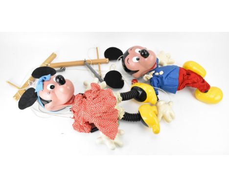 A pair of large pelham puppet shop display puppets of Mickey and Minnie, clothed in their traditional outfits, Minnie with po