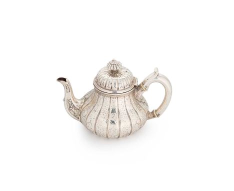 A Victorian silver bachelor's teapot, mark of R. & S. Garrard & Company, London 1853, in the Turkish style, the side with dec