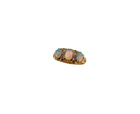 A late Victorian opal and diamond ring, three oval cabochon opals, from approximately 5 to 5.4mm, further set with four swiss