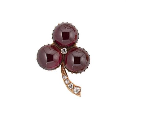 A garnet and diamond brooch, central rose cut diamond, with three claw set round cabochon garnets, stem set with graduated ro