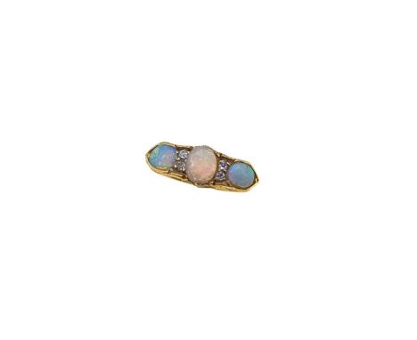 An Edwardian 18ct gold opal and diamond ring, the oval cabochon opals and four old brilliant cut diamonds, shank slightly mis