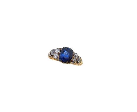 A sapphire and diamond ring claw set cushion shaped sapphire, approximately 8.1 x 6.6 x 6.15mm, estimated approximate weight 