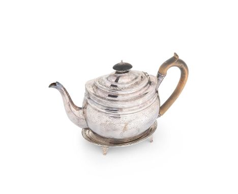 A George III silver tea pot with associated stand, the teapot with mark of Crispin Fuller, London 1802, of oval form with ste