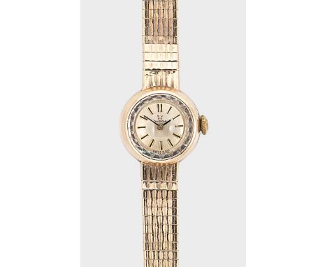 Omega - A 9ct gold wristwatch, circa 1961, model 996, serial number 18371254, circular silvered dial with black batons and ha