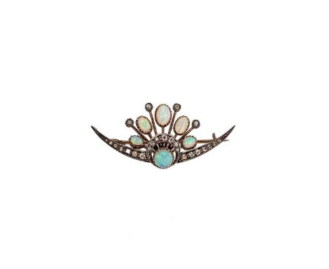 A Victorian opal and diamond crescent brooch, central round cabochon opal, with five graduated oval cabochon opals, further s