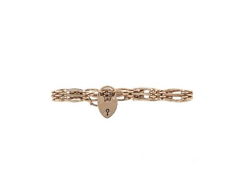A late 20th century 9ct gold bracelet, gate style bracelet, length 18cm, width 9.3mm, padlock clasp with integral safety chai